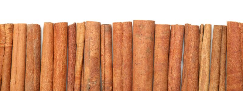 Cinnamon sticks frame isolated on white background, copy space